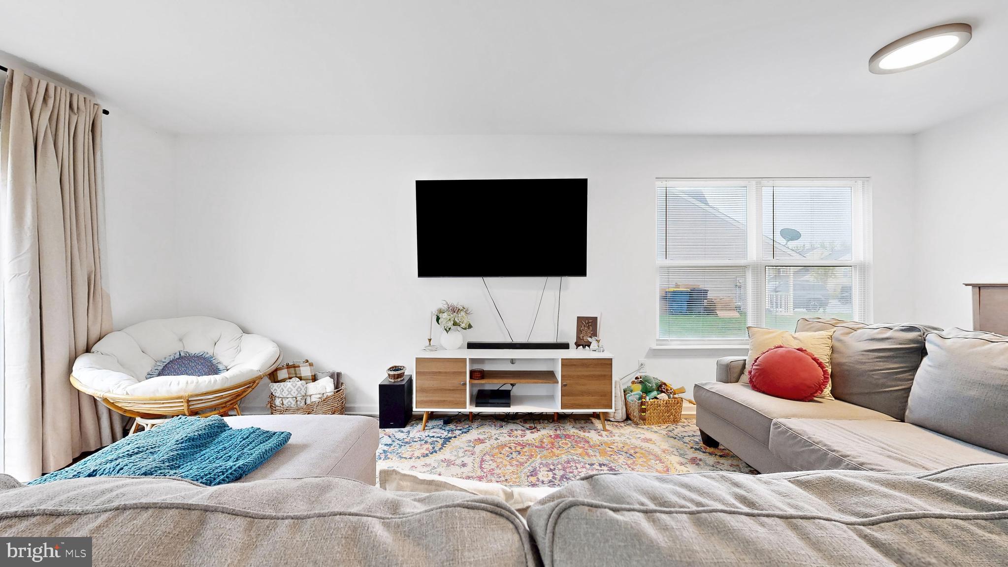 433 East Wind Drive Dover, DE 19901 - Photo 12 of 61 a bedroom with a bed and a flat screen tv