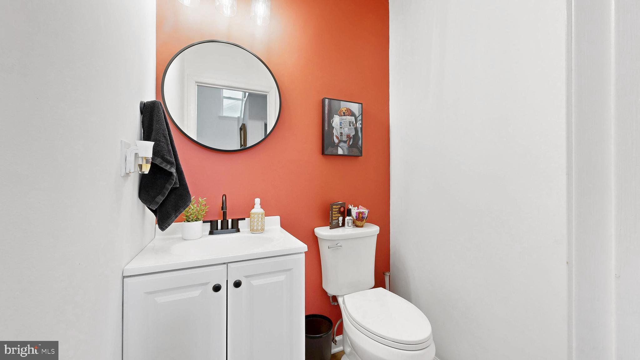 433 East Wind Drive Dover, DE 19901 - Photo 13 of 61 a white toilet sitting next to a bathroom sink
