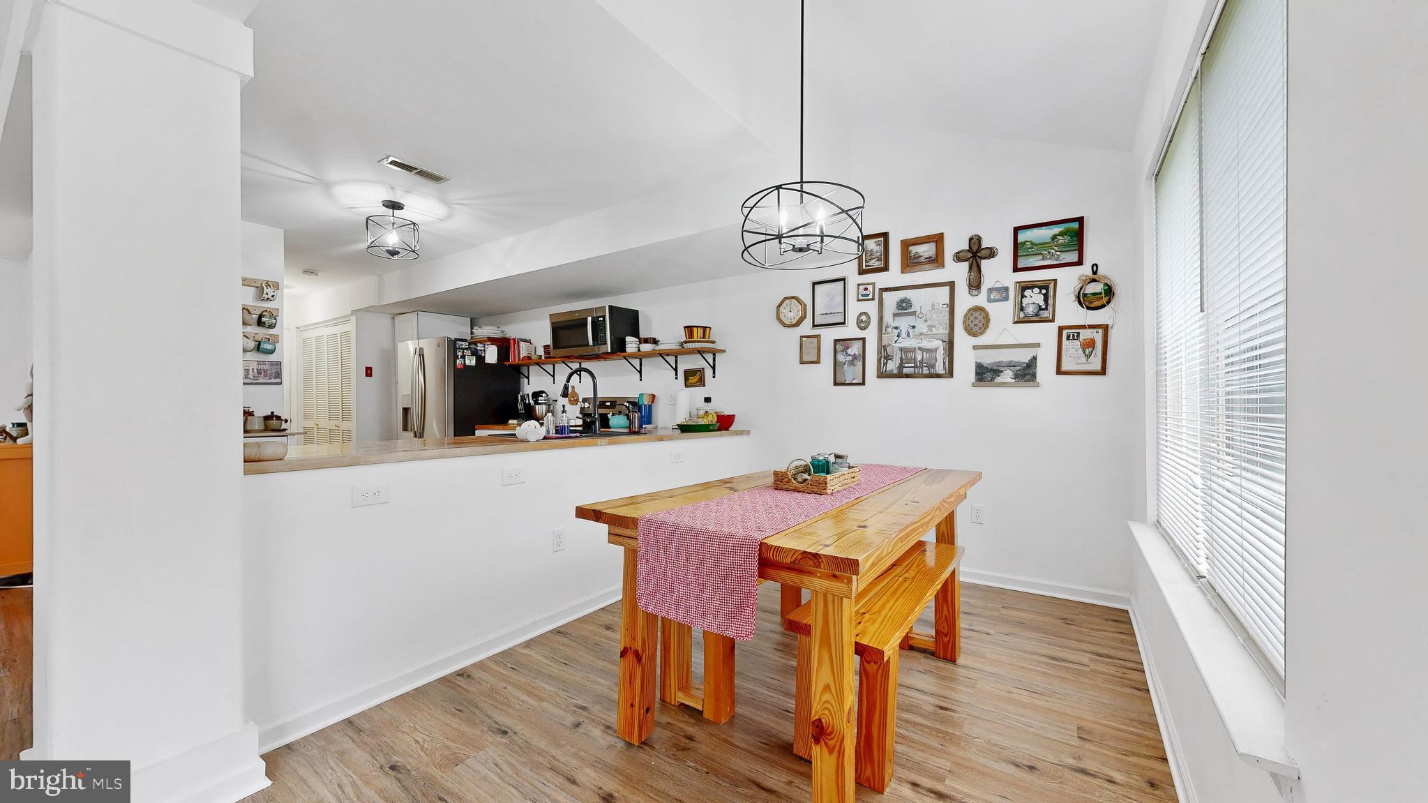 433 East Wind Drive Dover, DE 19901 - Photo 14 of 61 a view of a dining room with furniture and wooden floor