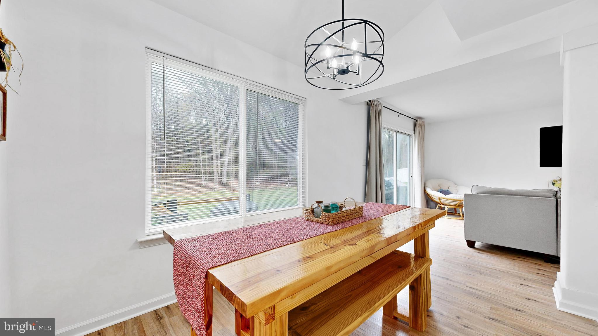 433 East Wind Drive Dover, DE 19901 - Photo 16 of 61 a view of a dining room with furniture window and wooden floor