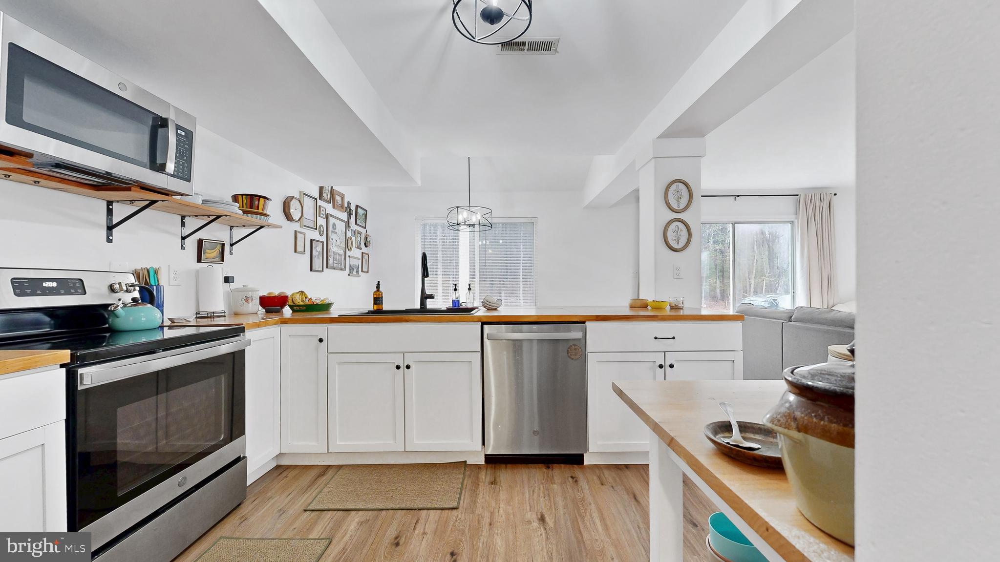 433 East Wind Drive Dover, DE 19901 - Photo 17 of 61 a kitchen with cabinets a sink and appliances