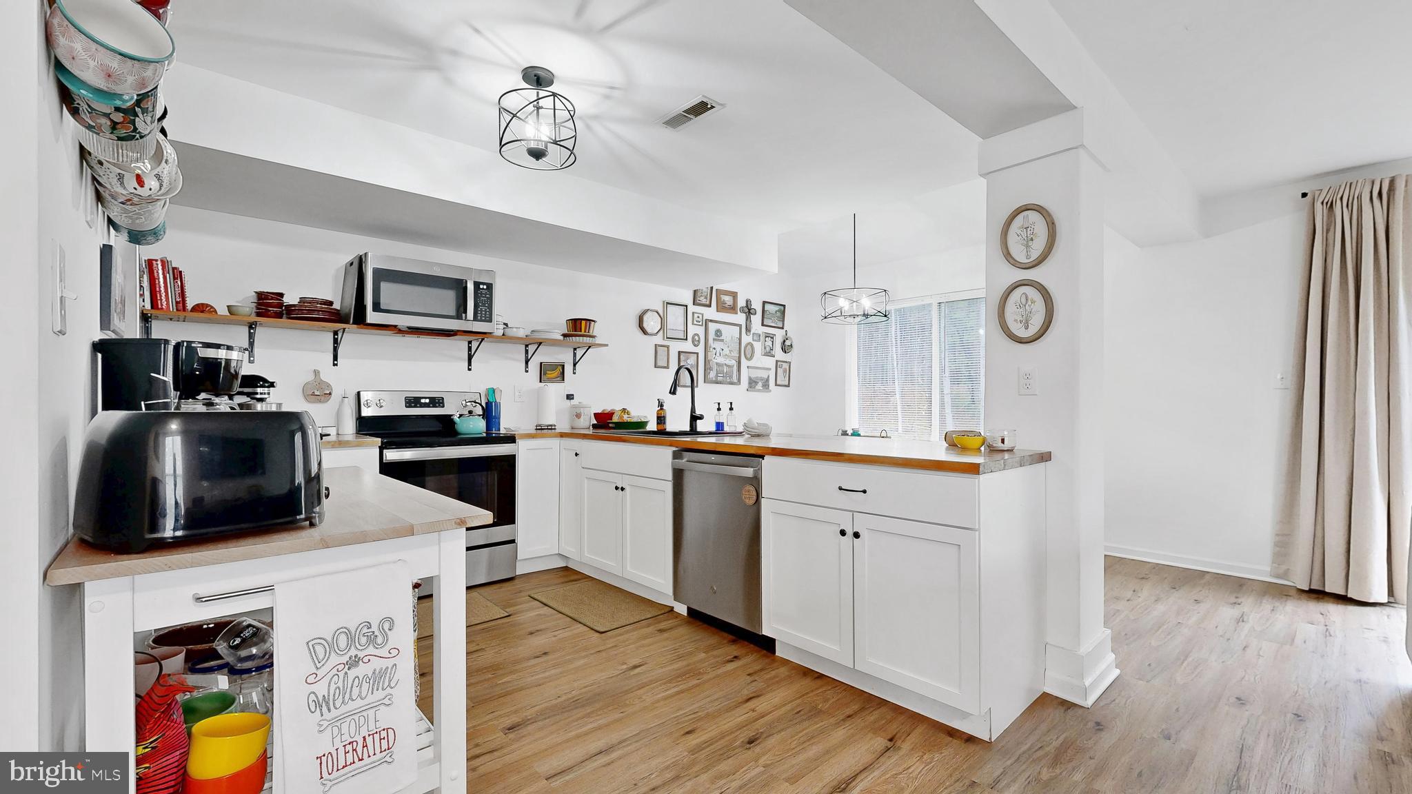 433 East Wind Drive Dover, DE 19901 - Photo 19 of 61 a kitchen with cabinets a sink and a stove top oven