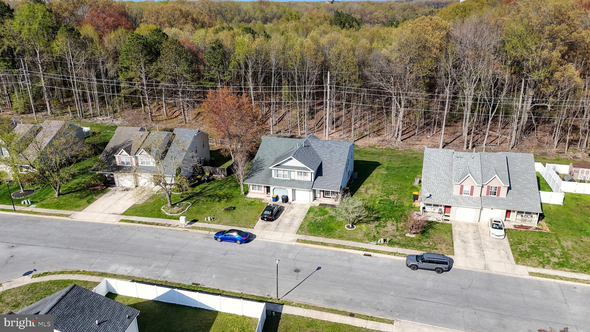 433 East Wind Drive Dover, DE 19901 - Photo 2 of 61 an aerial view of a house with a garden and parking space