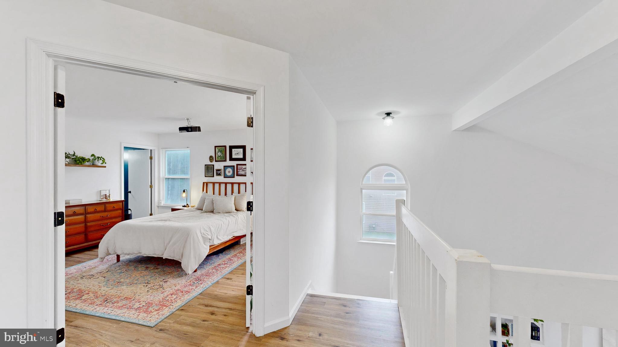 433 East Wind Drive Dover, DE 19901 - Photo 33 of 61 a bedroom with a bed and wooden floor
