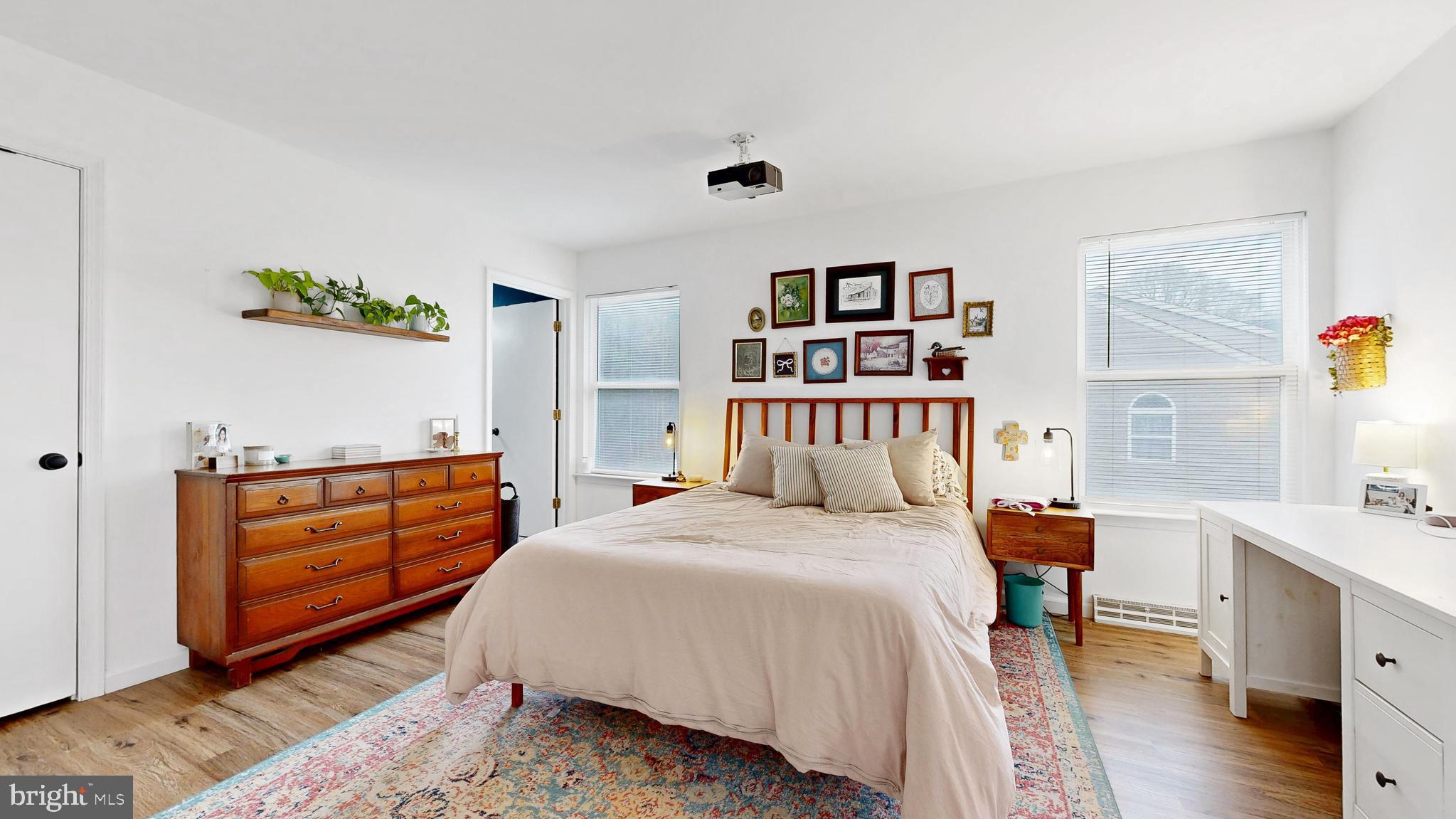 433 East Wind Drive Dover, DE 19901 - Photo 35 of 61 a bedroom with a bed and a book shelf