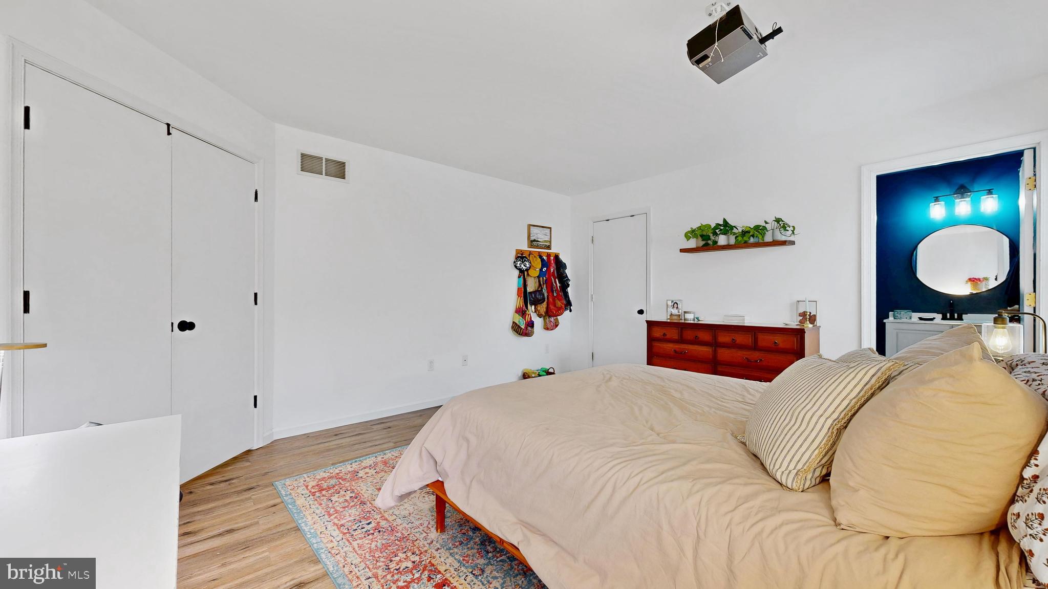 433 East Wind Drive Dover, DE 19901 - Photo 37 of 61 a bed room with a bed and painting on the wall