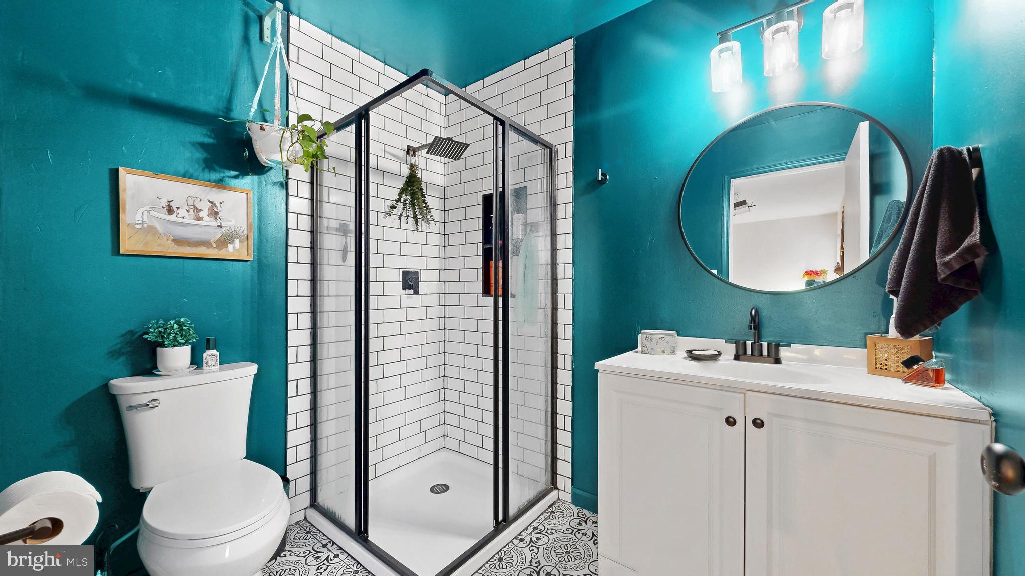 433 East Wind Drive Dover, DE 19901 - Photo 39 of 61 a bathroom with a toilet sink and mirror