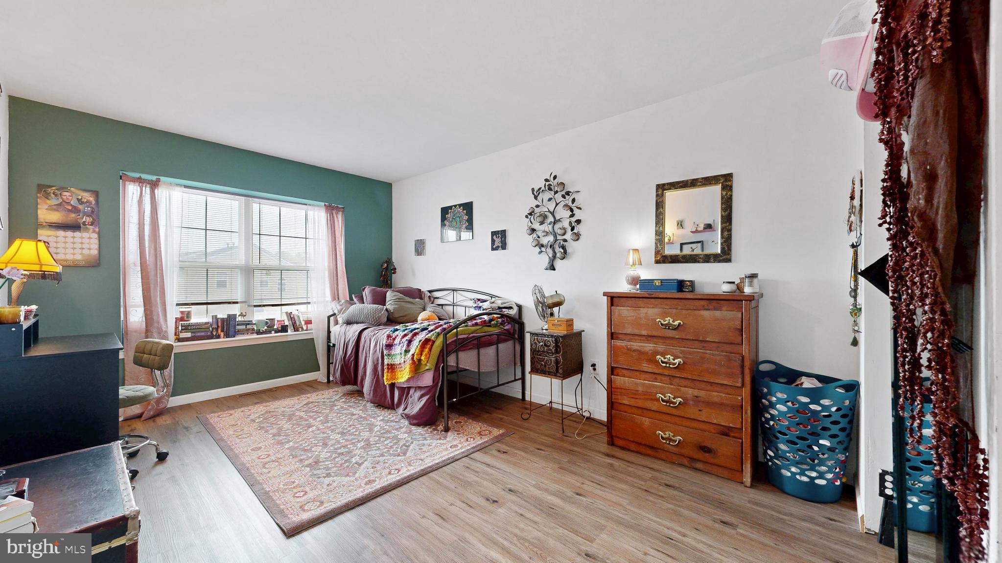 433 East Wind Drive Dover, DE 19901 - Photo 40 of 61 a bedroom with a bed and a dresser