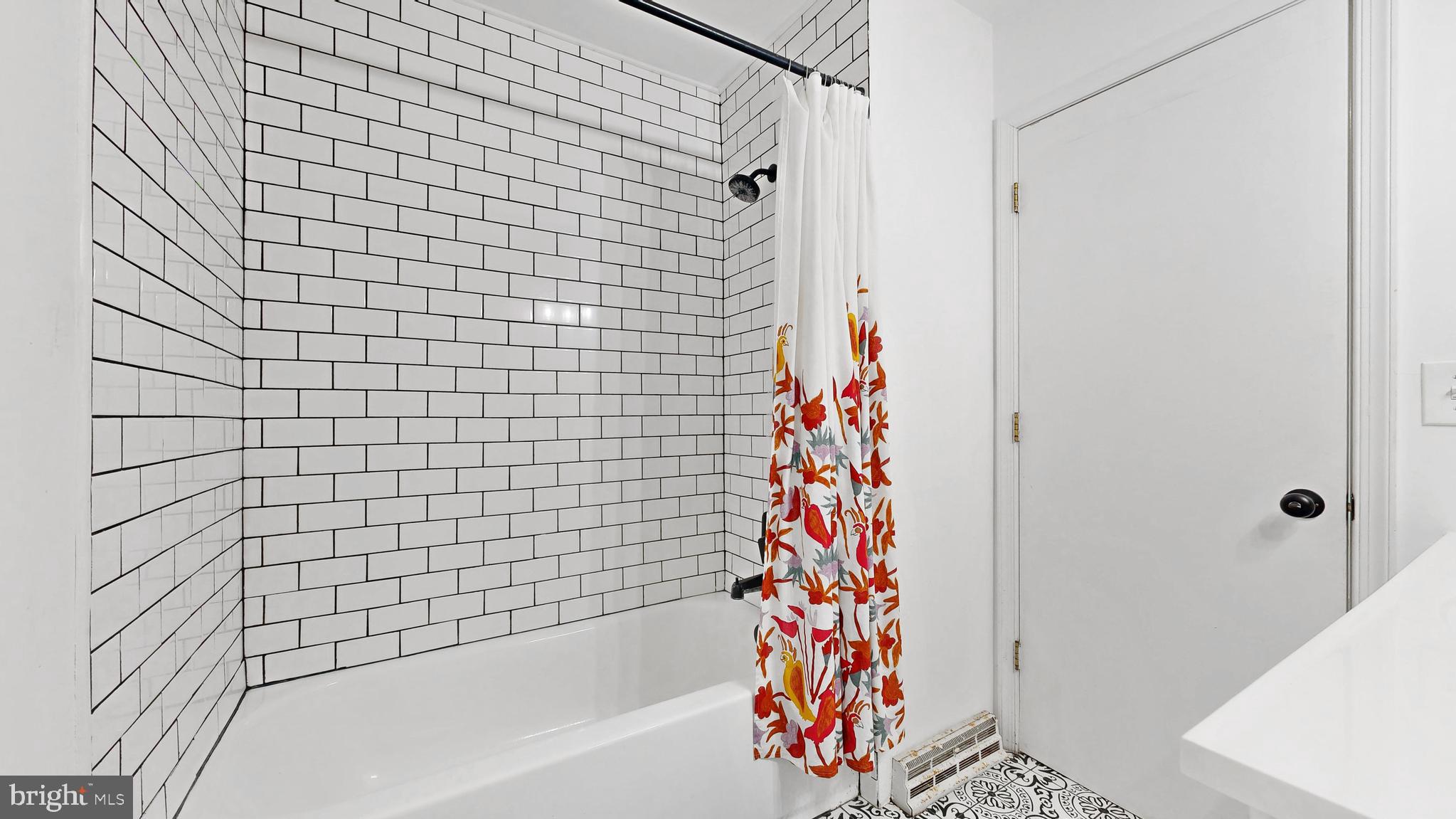 433 East Wind Drive Dover, DE 19901 - Photo 44 of 61 a bathroom with a bathtub and shower curtain