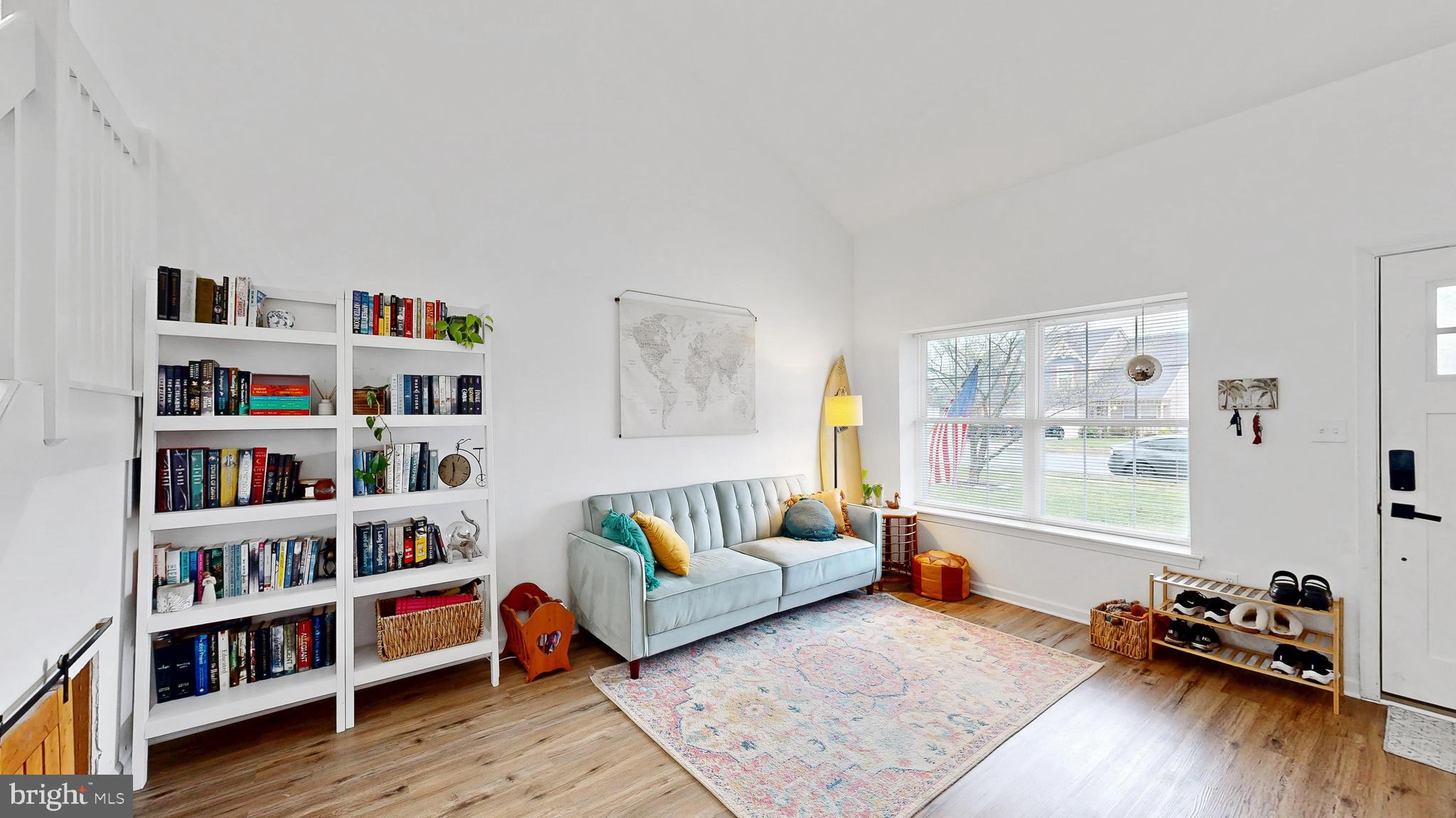 433 East Wind Drive Dover, DE 19901 - Photo 5 of 61 a living room with furniture and a book shelf