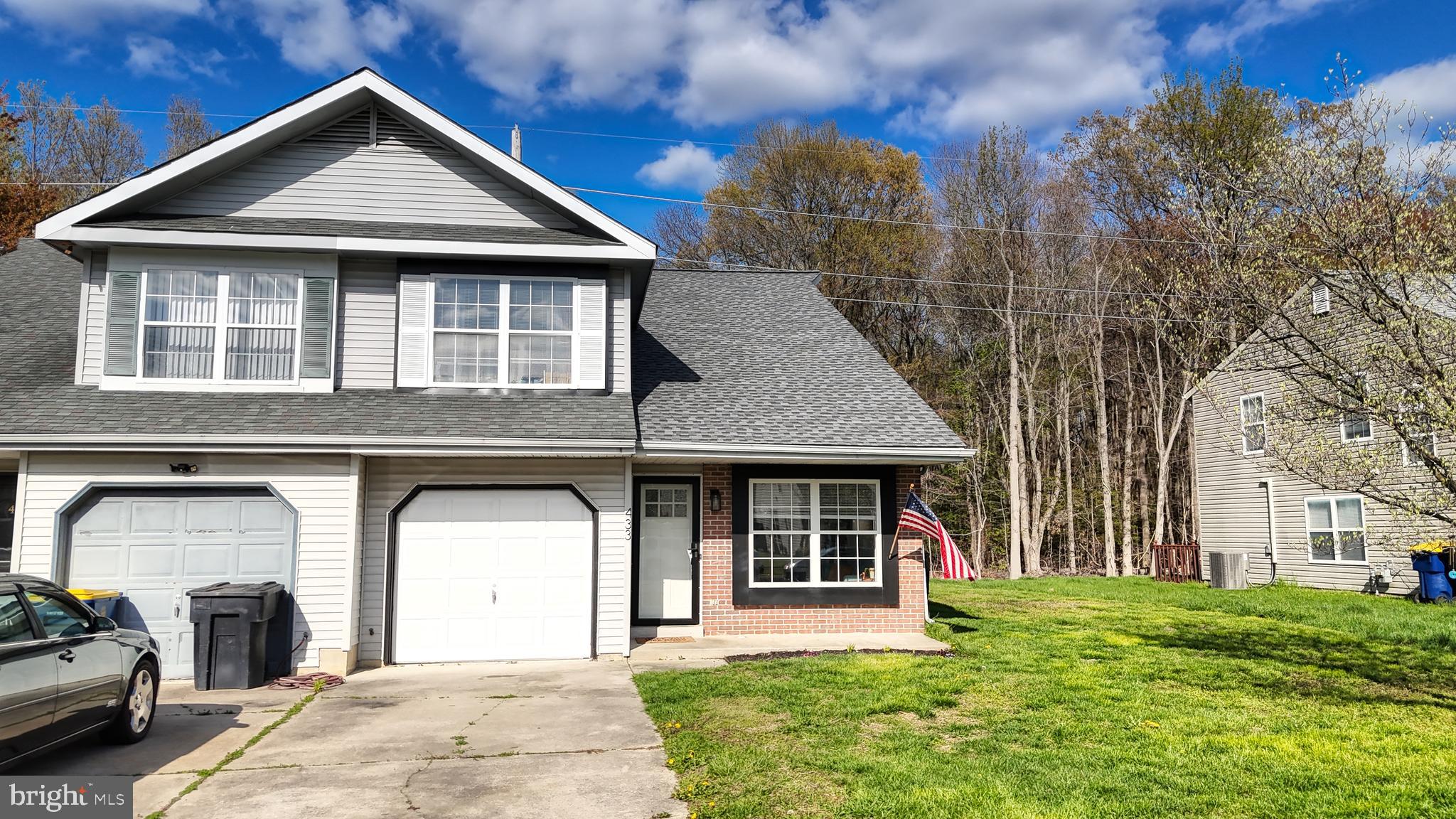 433 East Wind Drive Dover, DE 19901 - Photo 58 of 61 a front view of a house with garden