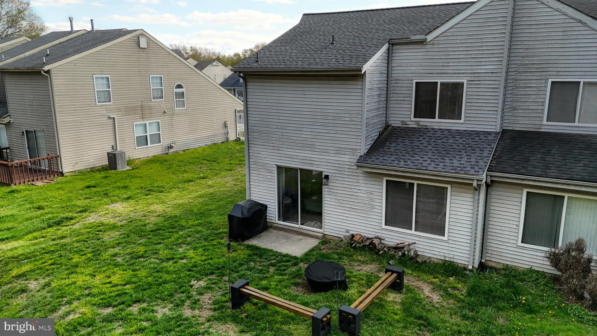 433 East Wind Drive Dover, DE 19901 - Photo 60 of 61 a backyard of a house with table and chairs