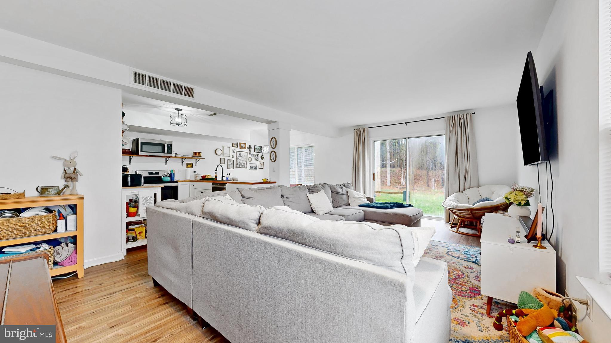 433 East Wind Drive Dover, DE 19901 - Photo 10 of 61 a living room with furniture and a flat screen tv