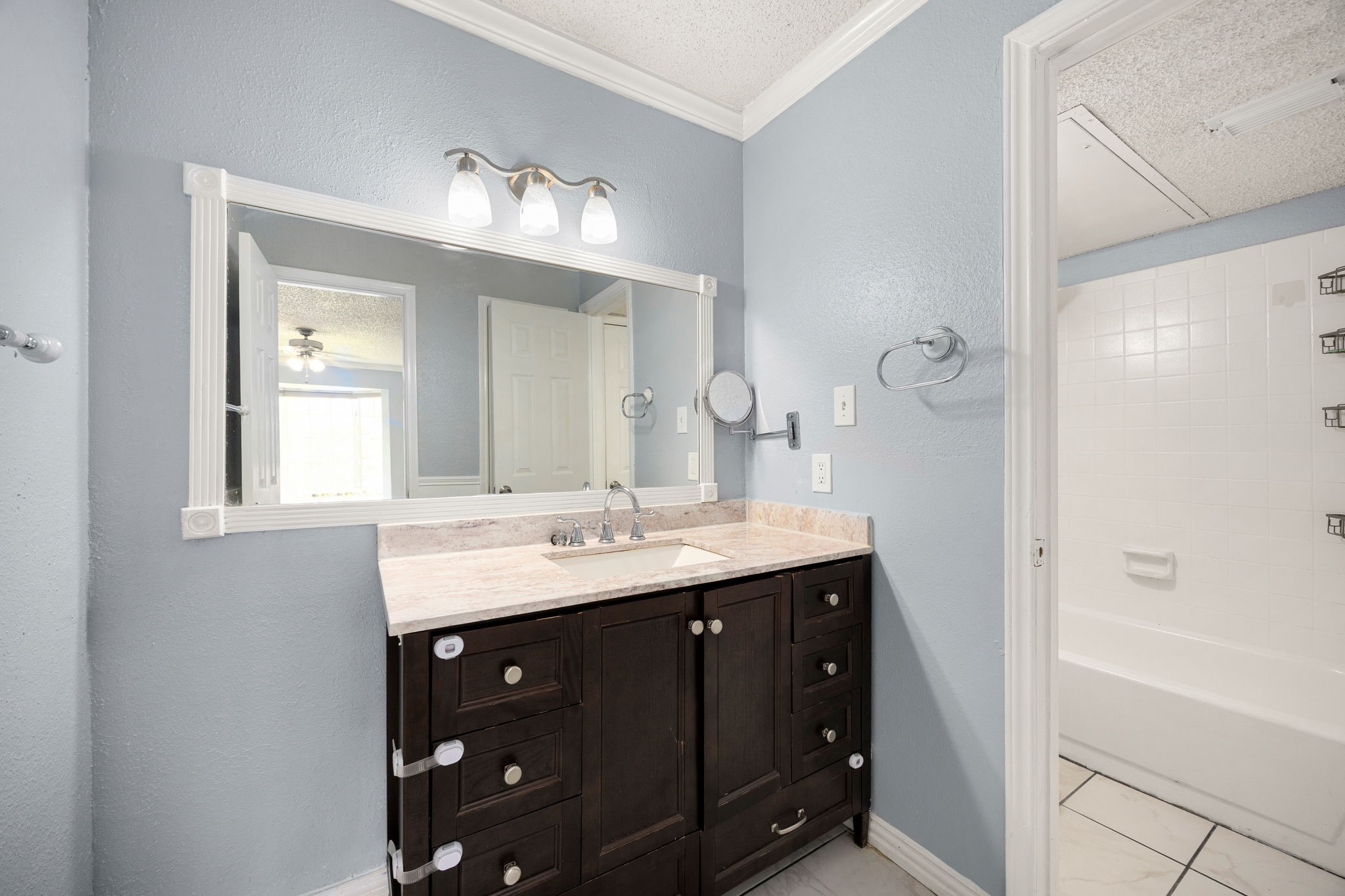 2121 Hepburn Street, Unit 710 Houston, TX 77054 - Photo 18 of 35 a bathroom with a double vanity sink and mirror with shower