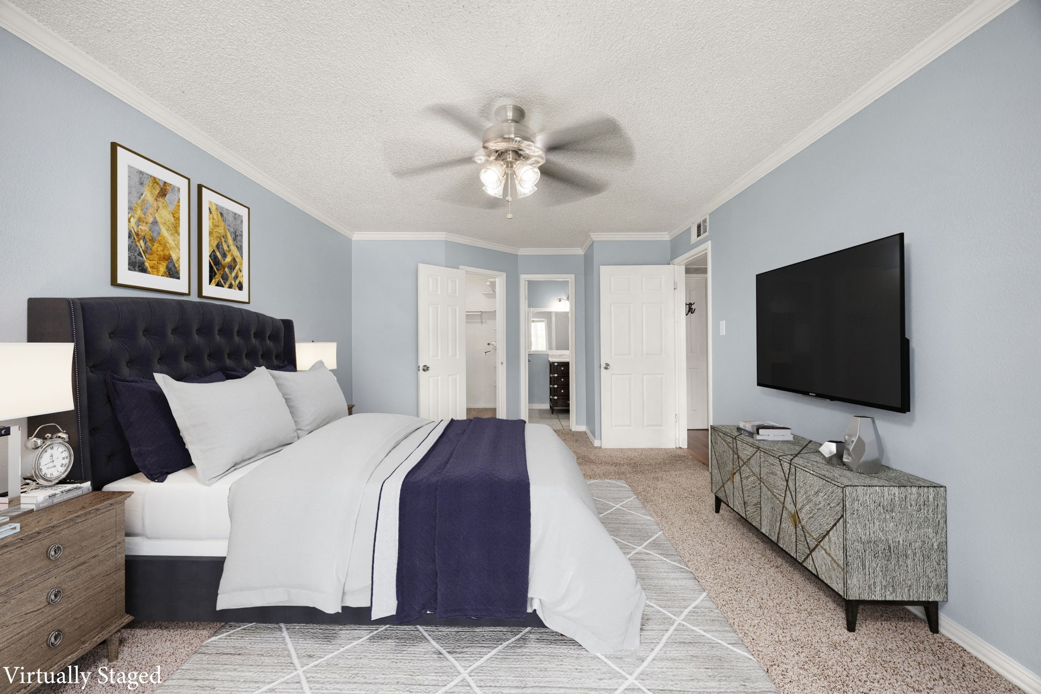 2121 Hepburn Street, Unit 710 Houston, TX 77054 - Photo 22 of 35 a spacious bedroom with a bed and a flat screen tv