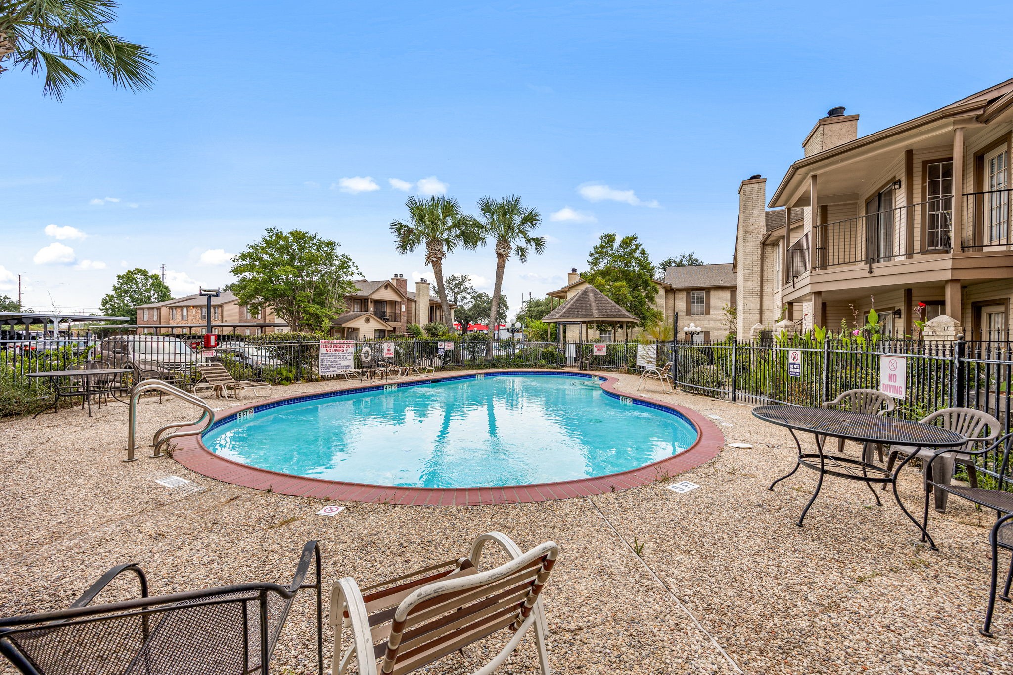 2121 Hepburn Street, Unit 710 Houston, TX 77054 - Photo 28 of 35 a view of a swimming pool with a lounge chairs