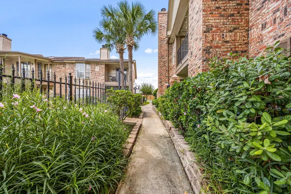 a view of a wrought iron fences in front of house