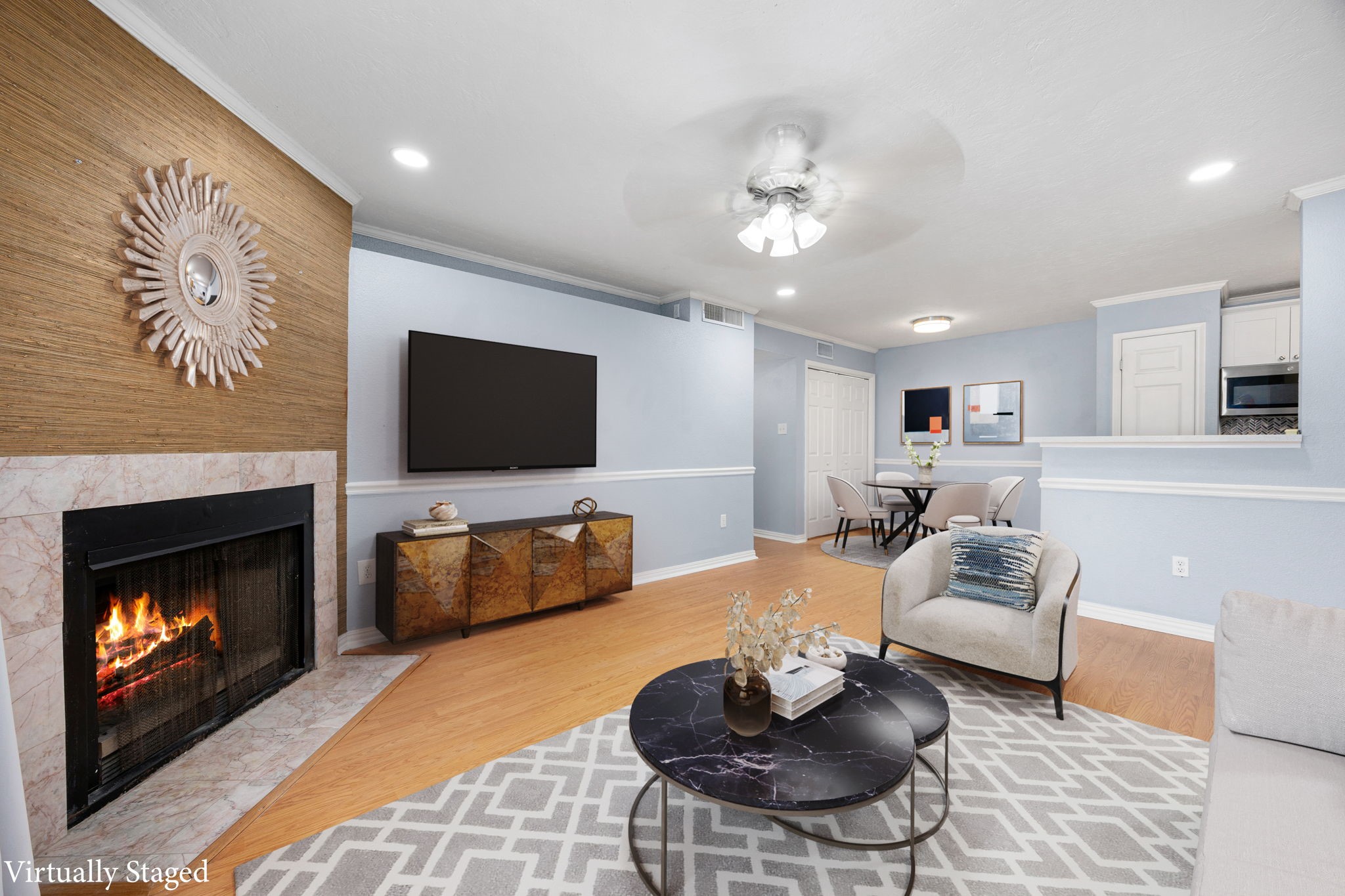 2121 Hepburn Street, Unit 710 Houston, TX 77054 - Photo 9 of 35 a living room with furniture a flat screen tv and a fireplace