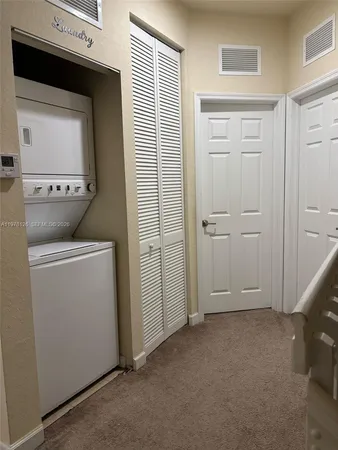 a view of storage and utility room with washer and dryer