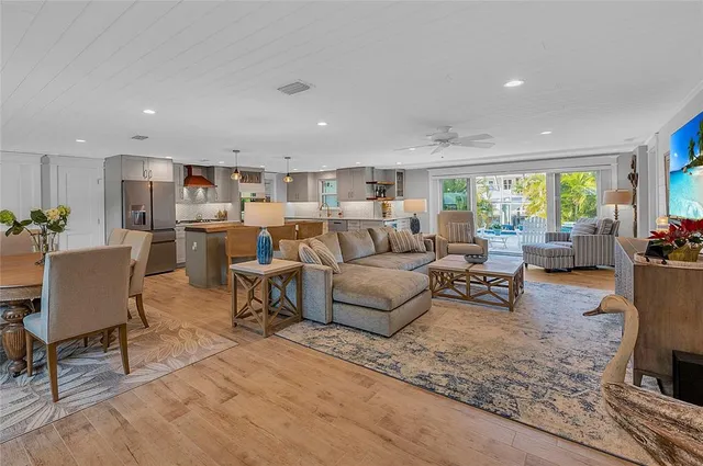 a large kitchen with a table and chairs in it