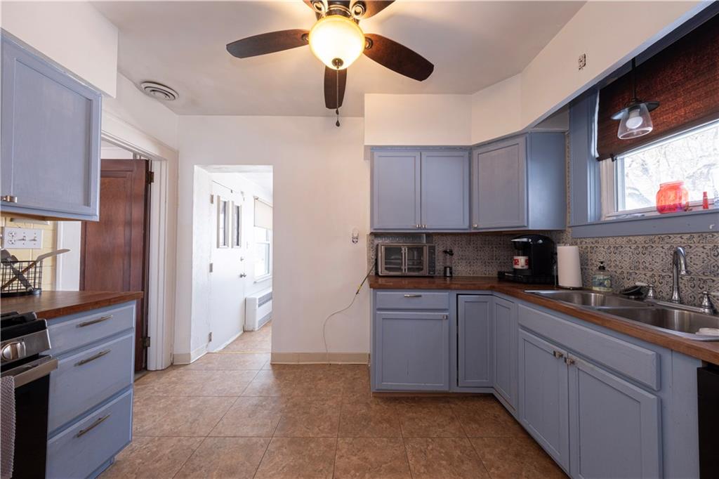 61 West Prospect Avenue Washington, PA 15301 - Photo 16 of 47 a kitchen with stainless steel appliances granite countertop a sink and cabinets