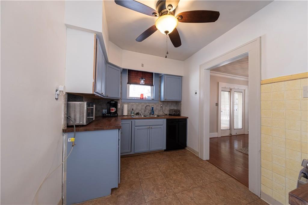 61 West Prospect Avenue Washington, PA 15301 - Photo 17 of 47 a kitchen with stainless steel appliances granite countertop a refrigerator and a sink
