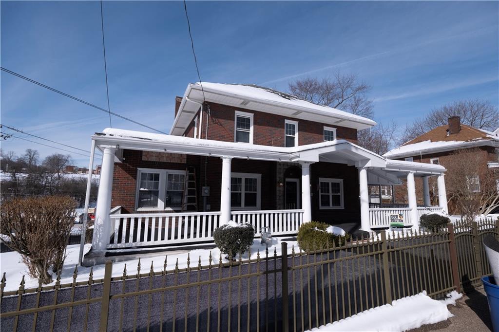 61 West Prospect Avenue Washington, PA 15301 - Photo 2 of 47 a front view of a house with a porch
