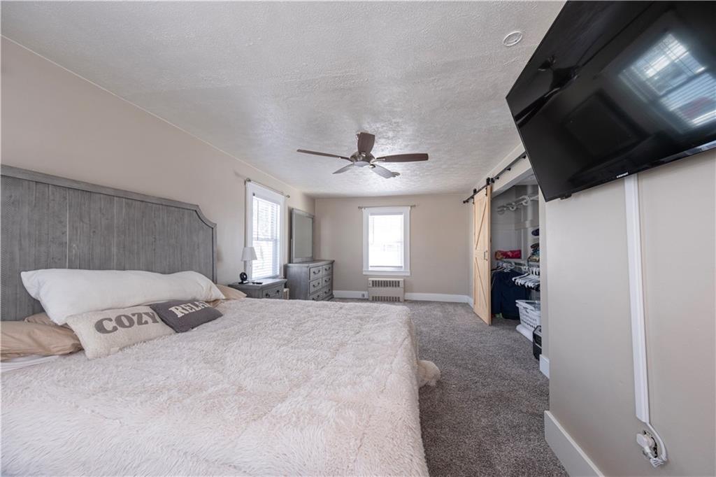 61 West Prospect Avenue Washington, PA 15301 - Photo 21 of 47 a view of a livingroom with a furniture flat screen tv and window
