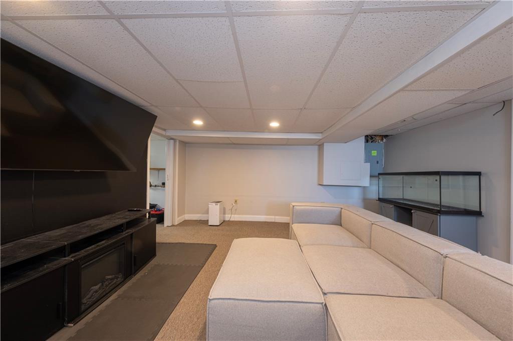 61 West Prospect Avenue Washington, PA 15301 - Photo 27 of 47 a living room with furniture and a flat screen tv