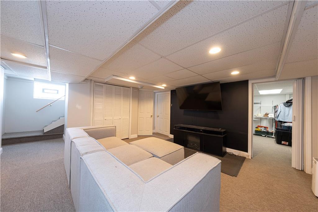 61 West Prospect Avenue Washington, PA 15301 - Photo 28 of 47 a living room with furniture and a flat screen tv