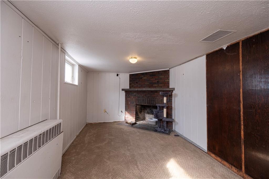 61 West Prospect Avenue Washington, PA 15301 - Photo 29 of 47 a view of an empty room with a fireplace