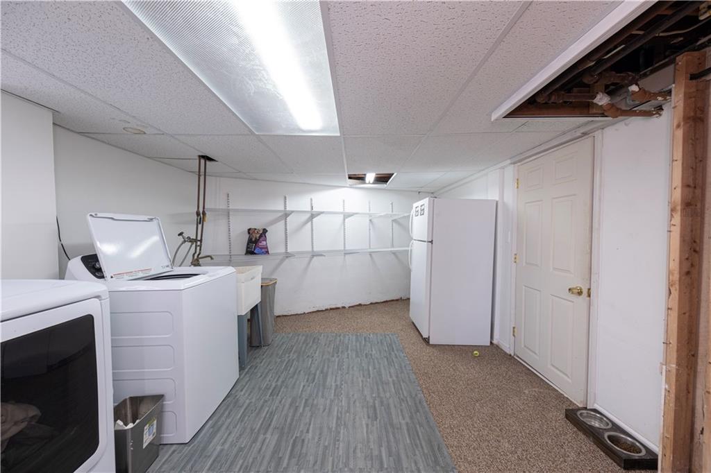61 West Prospect Avenue Washington, PA 15301 - Photo 33 of 47 a kitchen with cabinets and wooden floors