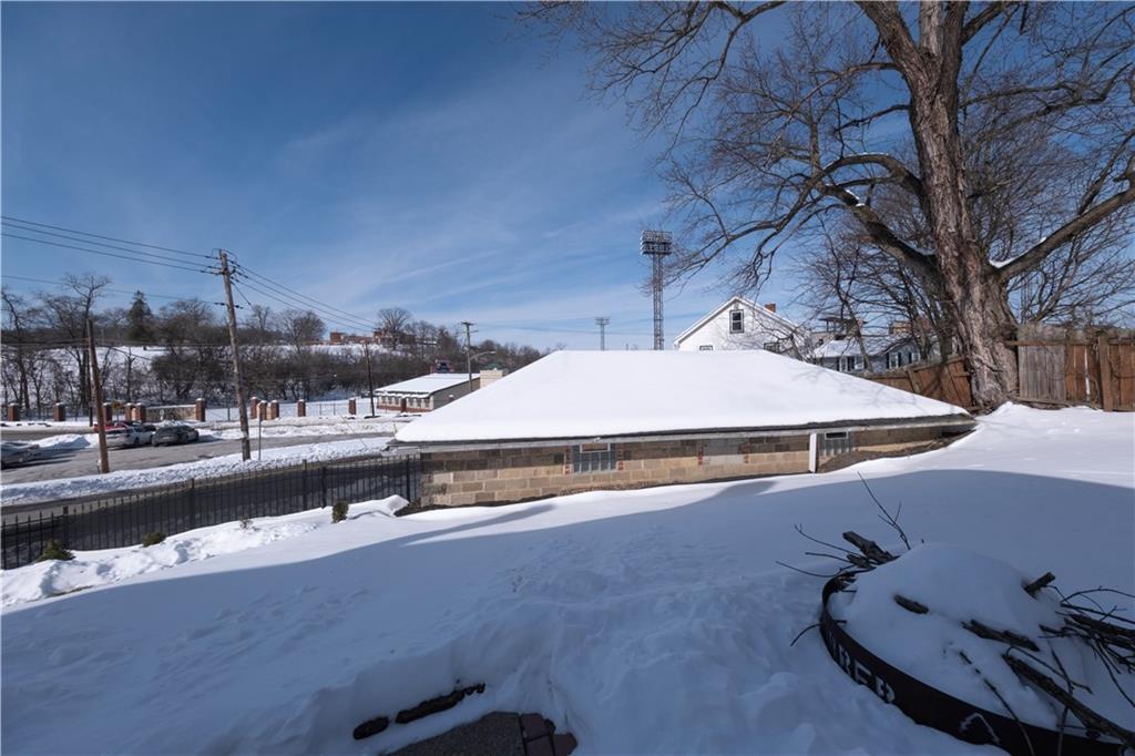61 West Prospect Avenue Washington, PA 15301 - Photo 36 of 47 a roof deck with table and chairs under an umbrella