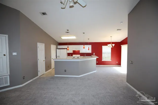 a view of a room with window and furniture