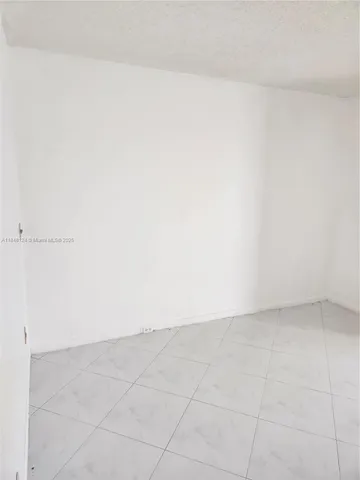 a large room with gym equipment