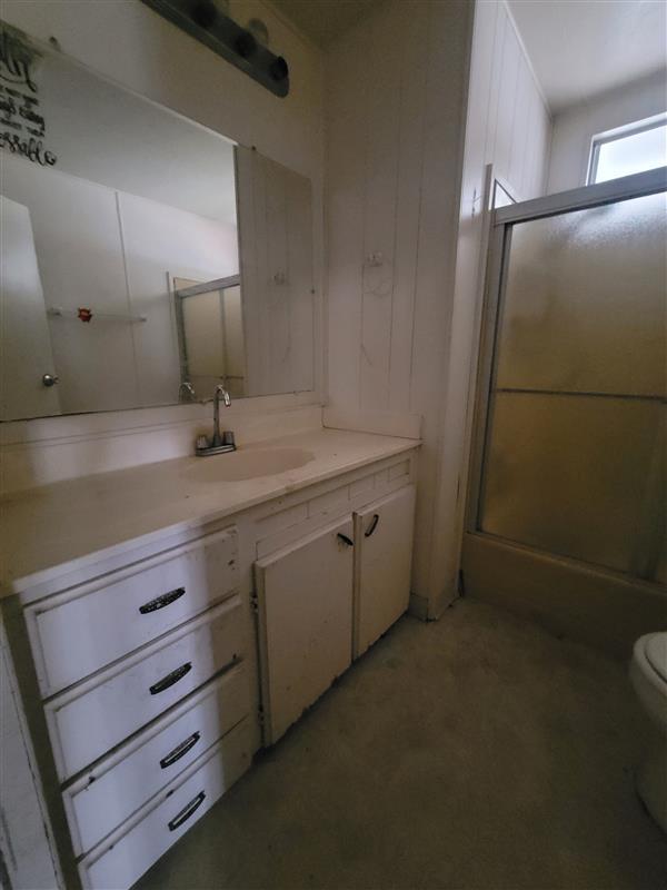 395 Brannan Island Road, Unit 1 Isleton, CA 95641 - Photo 6 of 8 a bathroom with a granite countertop sink a toilet and a mirror
