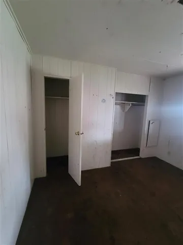a bathroom with a granite countertop sink a mirror and a shower