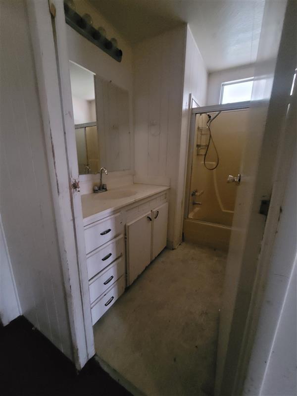 395 Brannan Island Road, Unit 1 Isleton, CA 95641 - Photo 8 of 8 a bathroom with a granite countertop sink a mirror and a shower