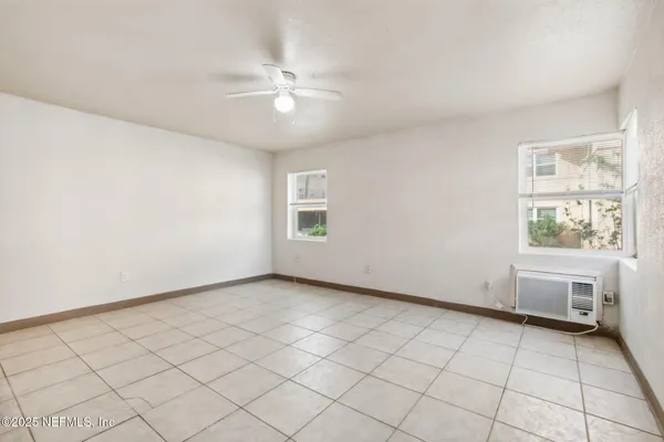 a view of an empty room with a window