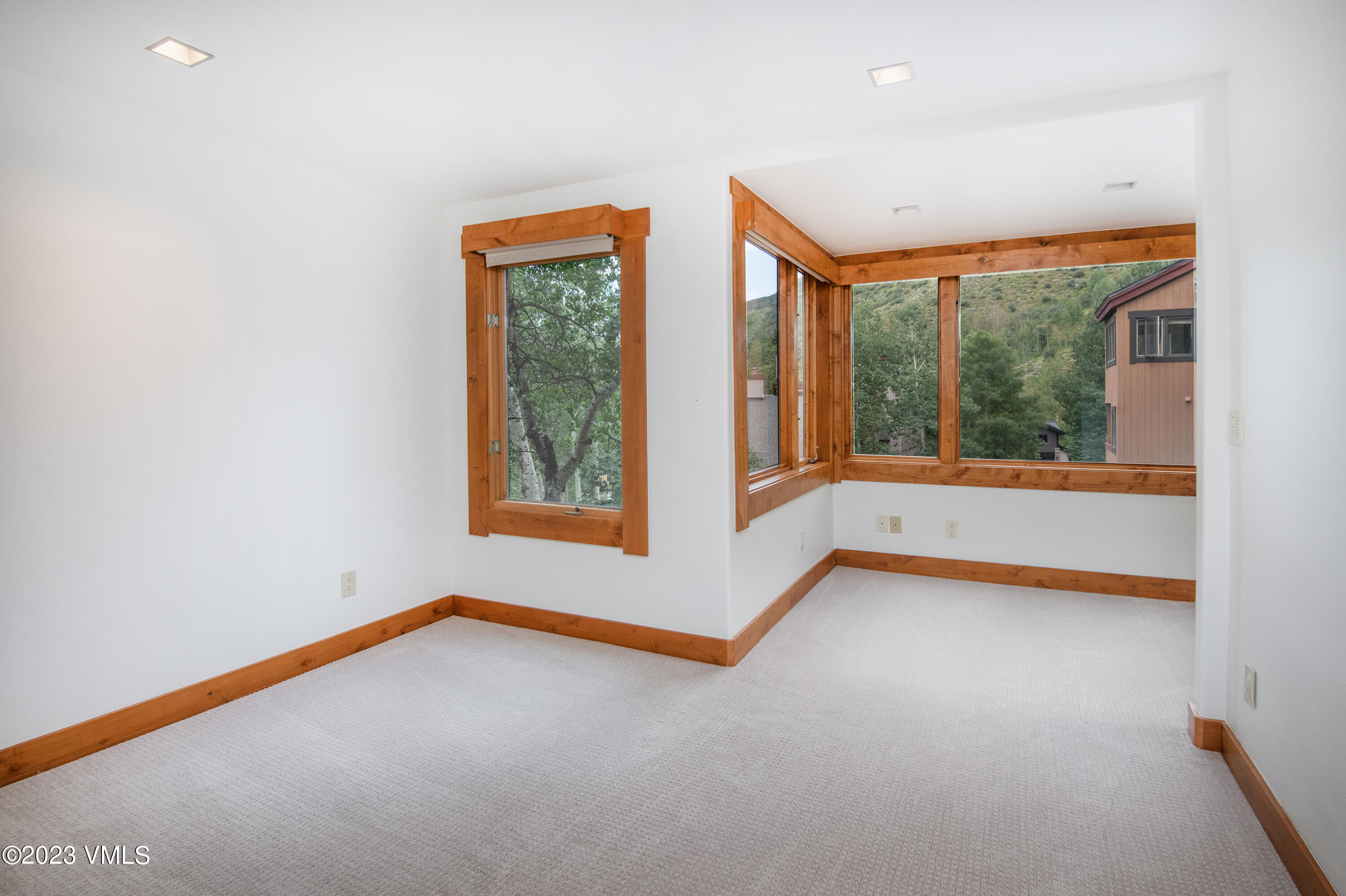 3094 Booth Falls Road, Unit 17 Vail, CO 81657 - Photo 12 of 27 an empty room with windows