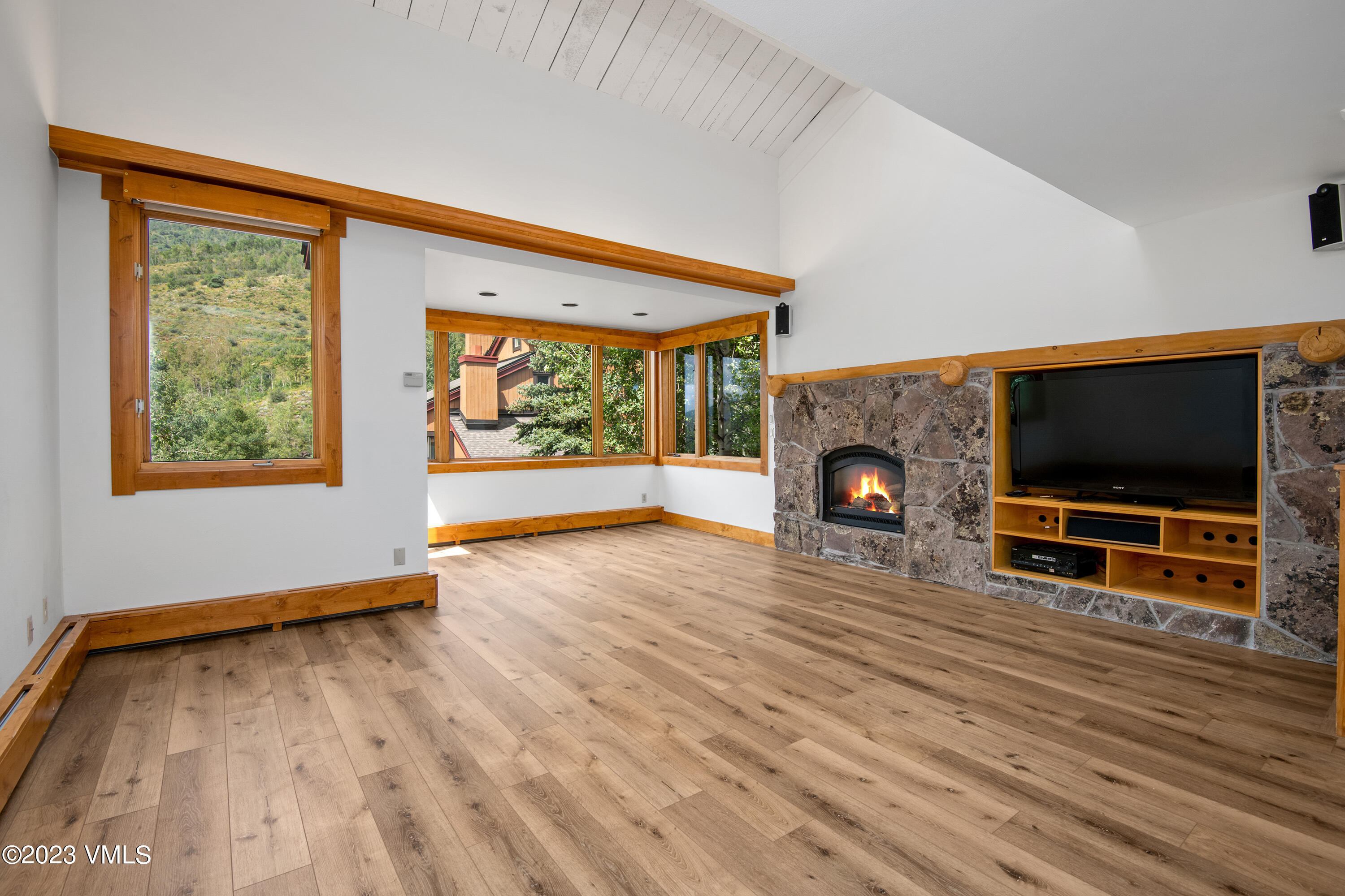 3094 Booth Falls Road, Unit 17 Vail, CO 81657 - Photo 2 of 27 a living room with furniture and a flat screen tv