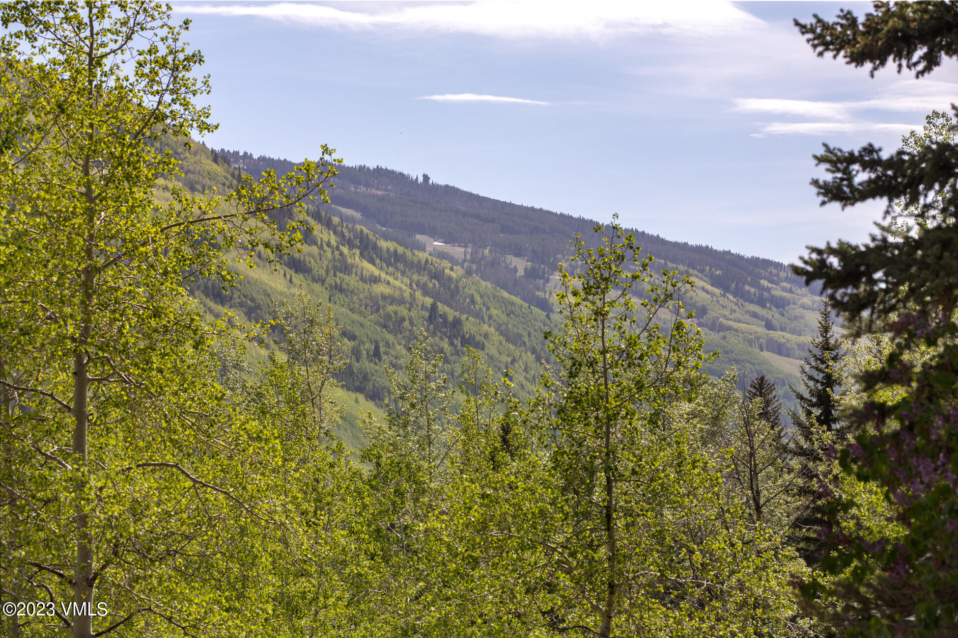 3094 Booth Falls Road, Unit 17 Vail, CO 81657 - Photo 26 of 27 a view of a large building with a mountain in the background