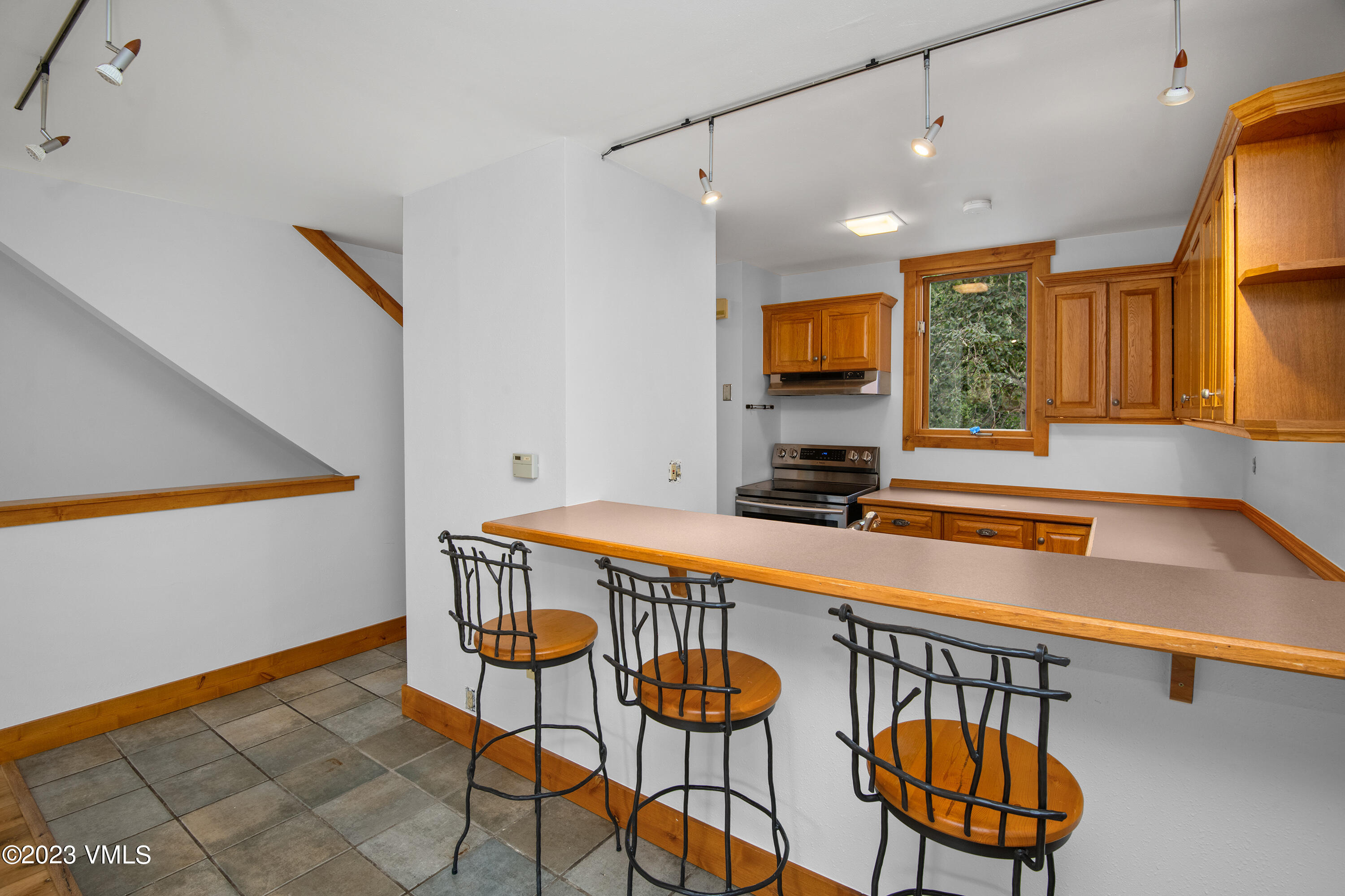 3094 Booth Falls Road, Unit 17 Vail, CO 81657 - Photo 8 of 27 a room with table chairs and wooden floor