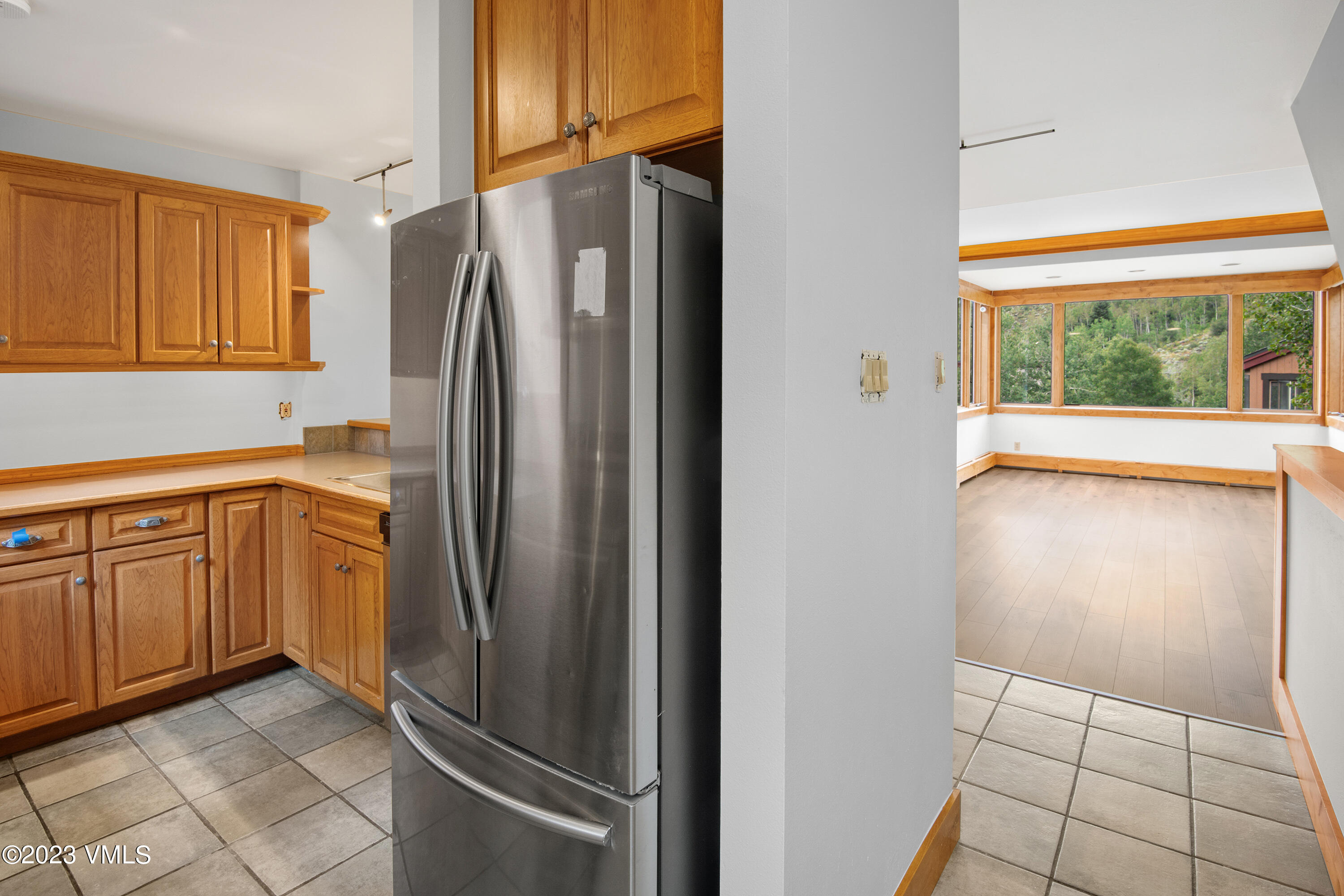 3094 Booth Falls Road, Unit 17 Vail, CO 81657 - Photo 9 of 27 a kitchen with stainless steel appliances granite countertop a refrigerator and a sink