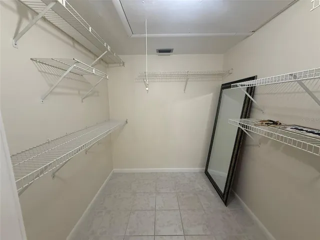 a view of a storage & utility room with racks on the wall