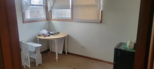 a bathroom with a toilet and a shower curtain