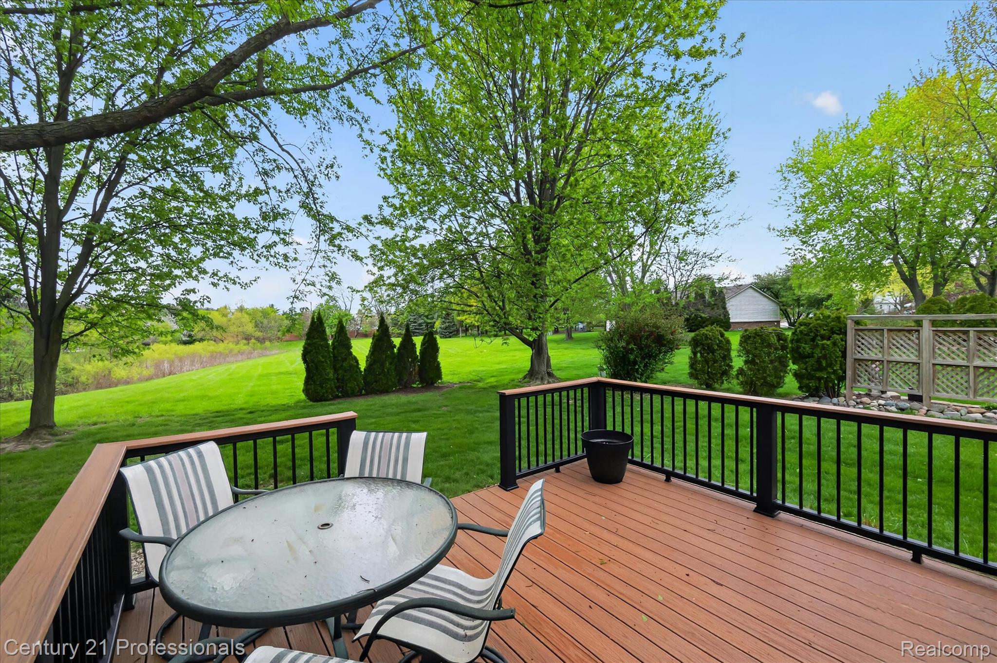 134 Foxboro Drive Rochester, MI 48309 - Photo 37 of 39 Wooden terrace with outdoor dining space and a lawn