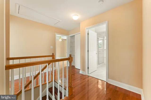 a view of staircase with wooden floor