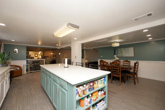 a kitchen with a table and chairs in it
