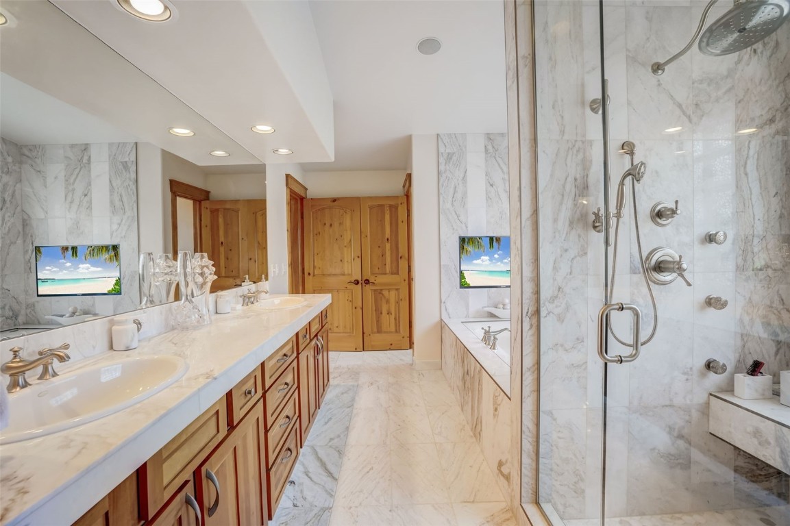 145 Gold Run Circle Dillon, CO 80435 - Photo 17 of 50 a spacious bathroom with a double vanity sink mirror and shower